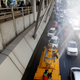 Thai workers spray water into the air along the main road in Bangkok in an attempt to ease the effects of bad pollution on Jan. 22.